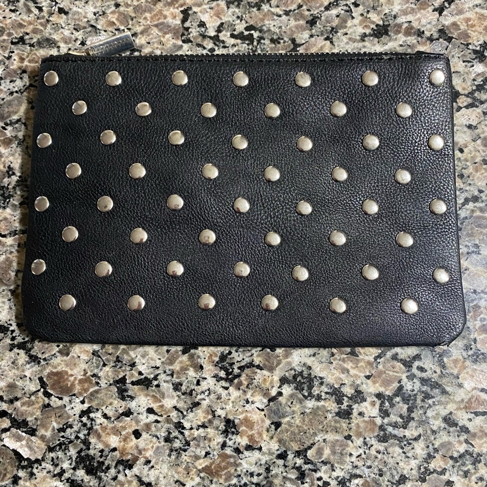 Black bag with silver studs. Great for makeup or a little clutch